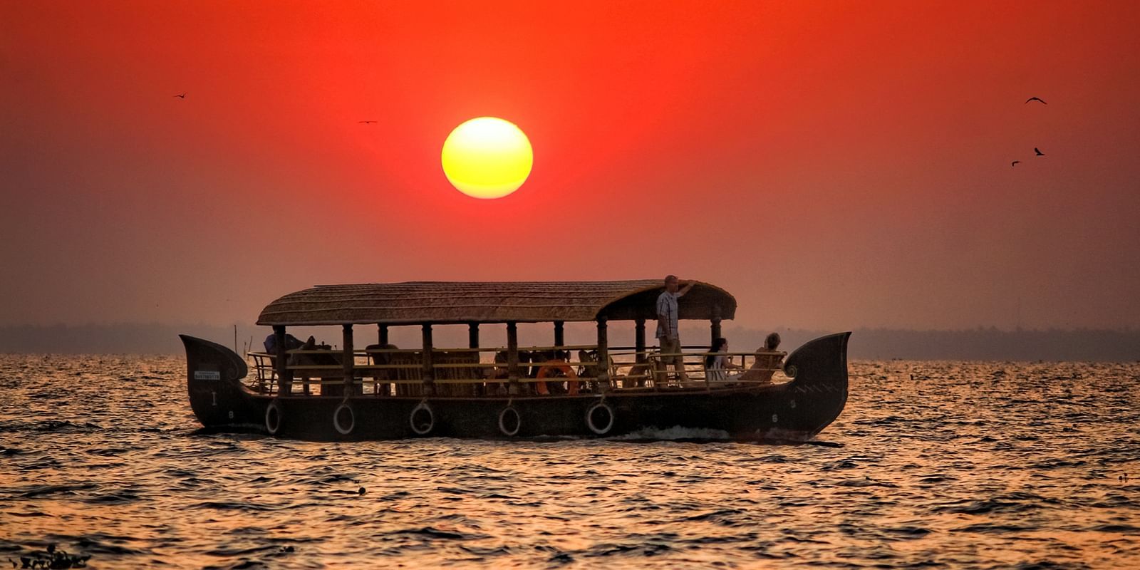 elegant boathouse in Kumarakom captured during the sunset