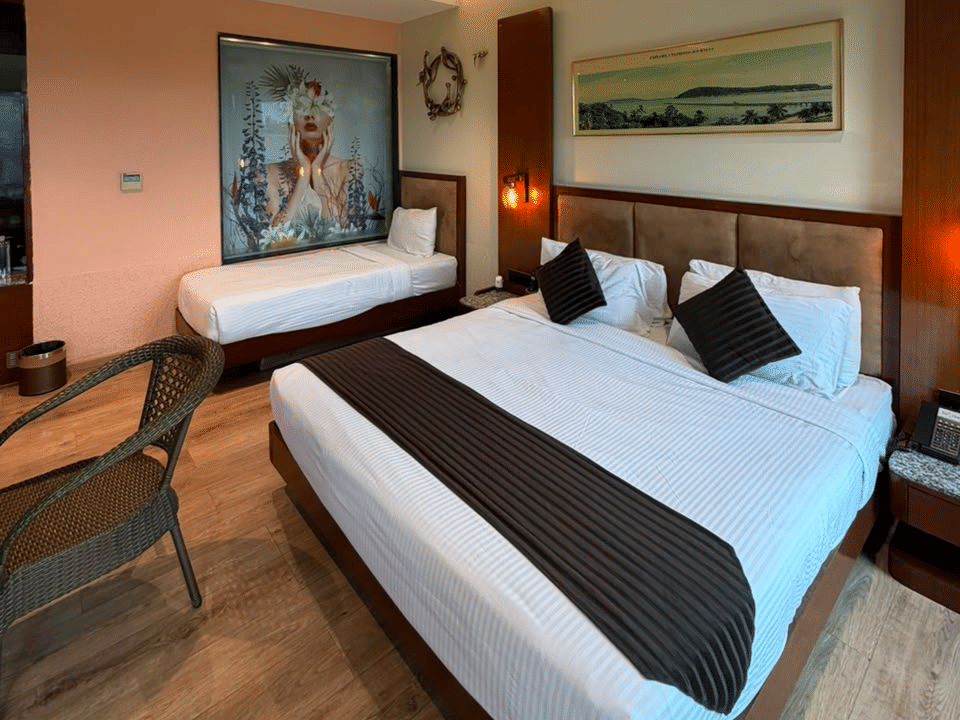Family Room, King bed with seating and artwork
