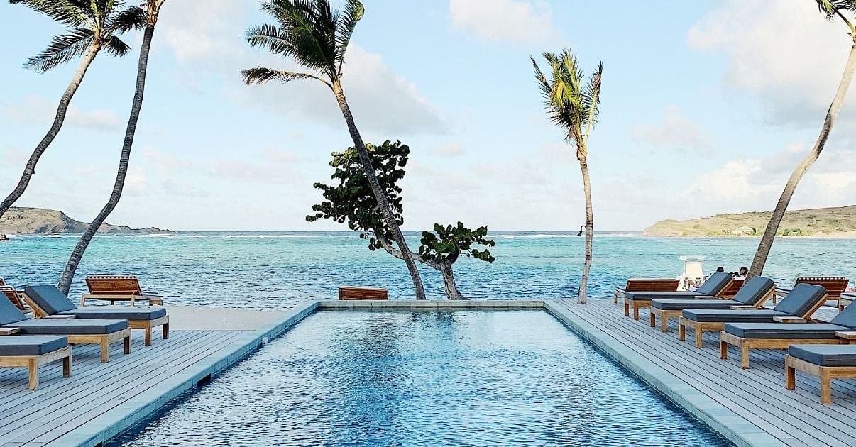 Infinity Swimming pool with the sea in the background at Ocean Spray, Puducherry
