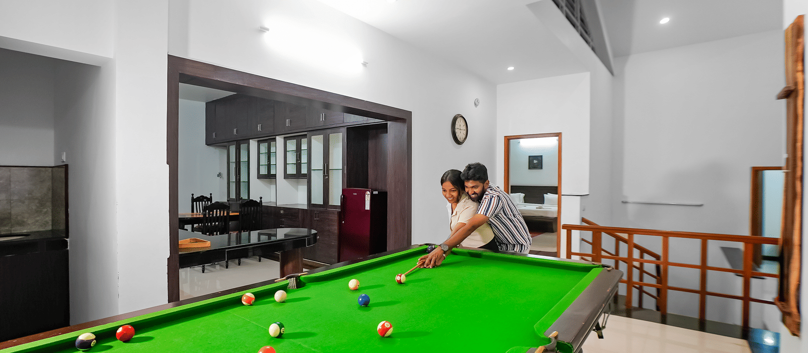 A view of a couple playing pool at WOW Bungalow, Yercaud. 