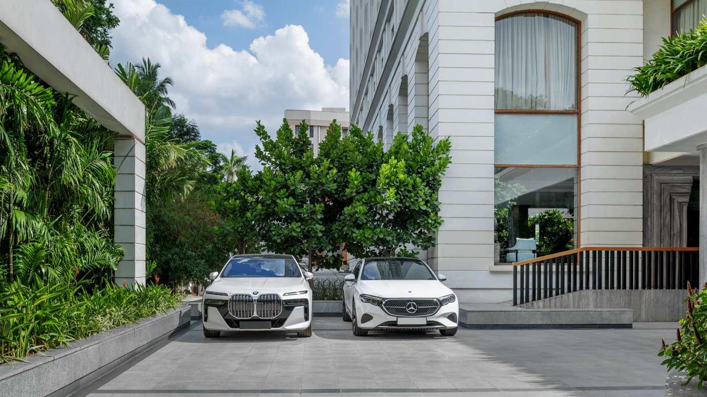 Hotel driveway with parked cars and building exterior at The Raintree, St. Mary’s Road.