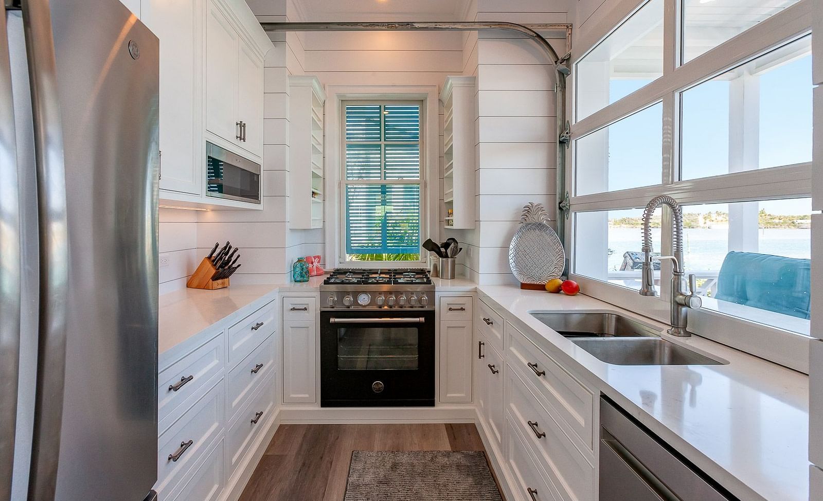 Modern kitchen with stainless steel appliances and white cabinetry | Abaco Inn