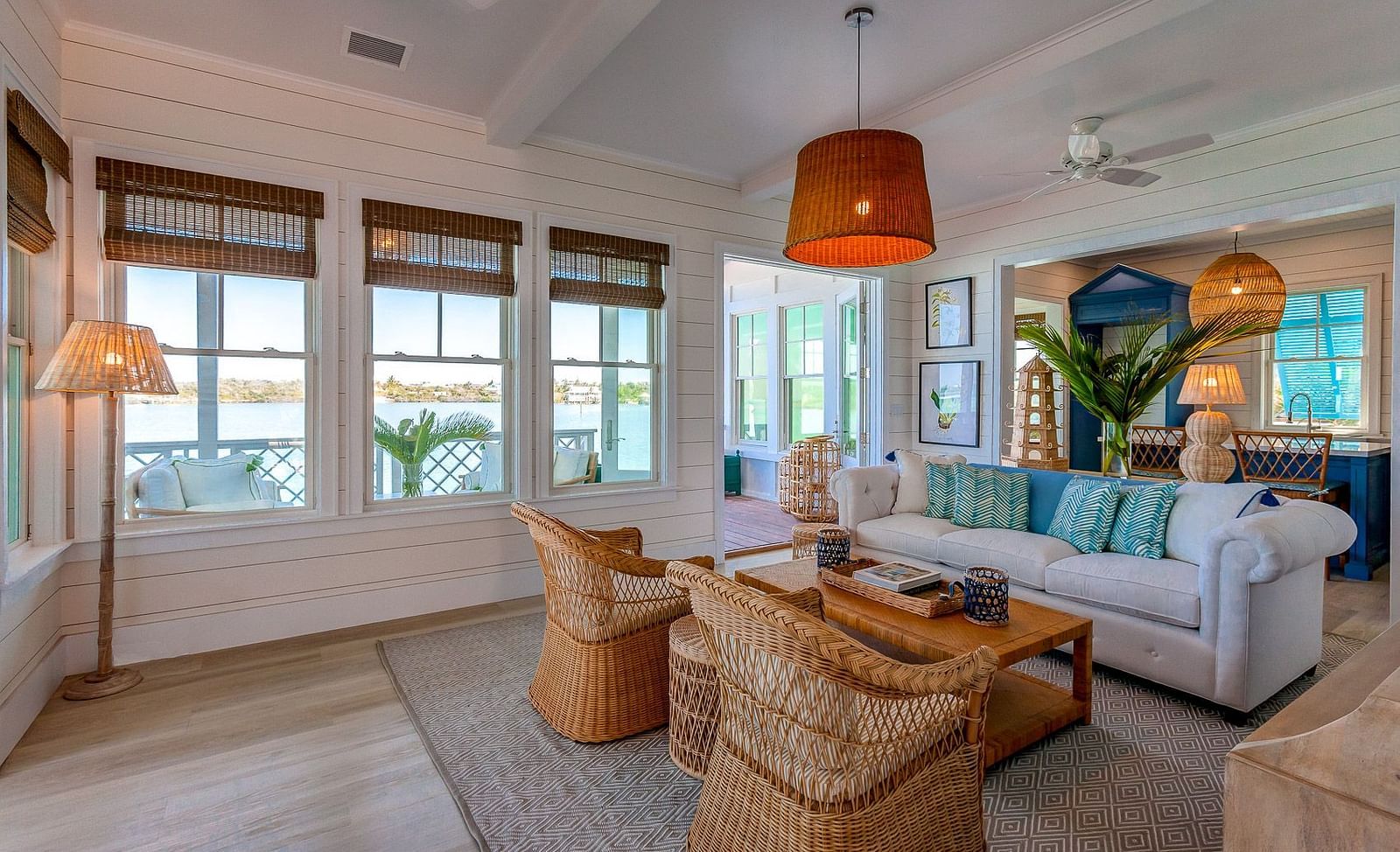 Cozy living space with wicker furniture and white sofas | Abaco Inn