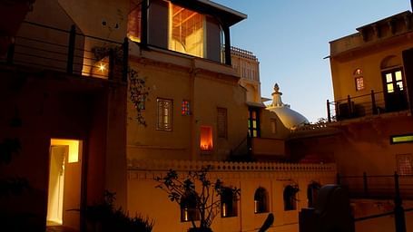 A facade image of Kankarwa Haveli lit during a night time
