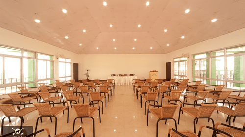 seating arrangement at one of the banquet halls in Polo Cherrapunjee Resort