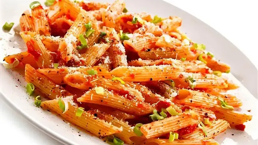 A dish of pasta placed on a surface at Indie Stays Resort, Goa.