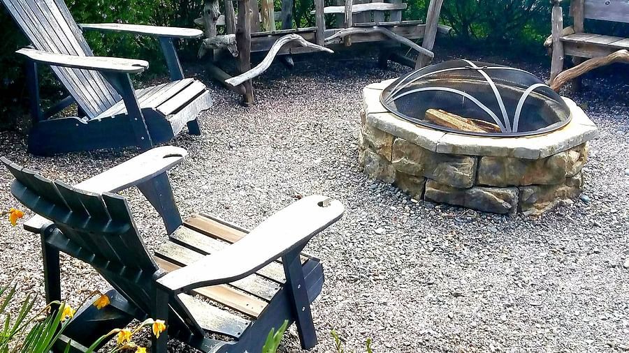 A fire pit area with Adirondack chairs - Brewery Gulch Inn & Spa