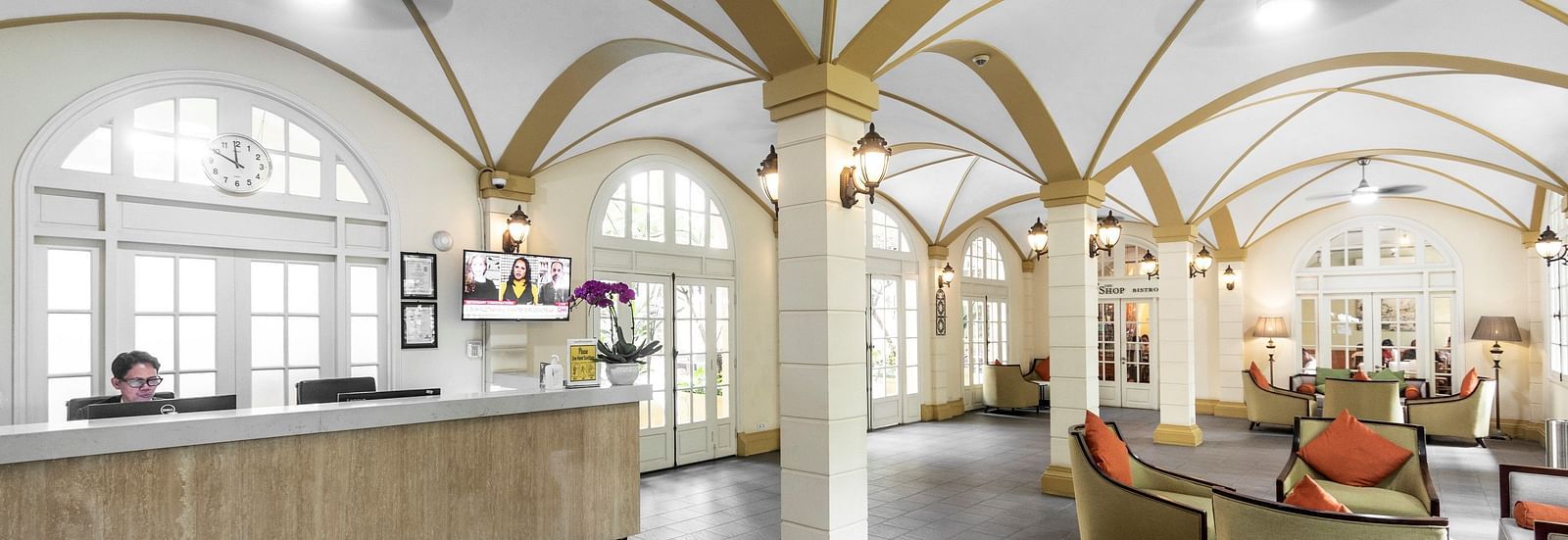 An interior shot of a lobby with high, arched ceilings and elegant furniture | Central Mansions, Phnom Penh