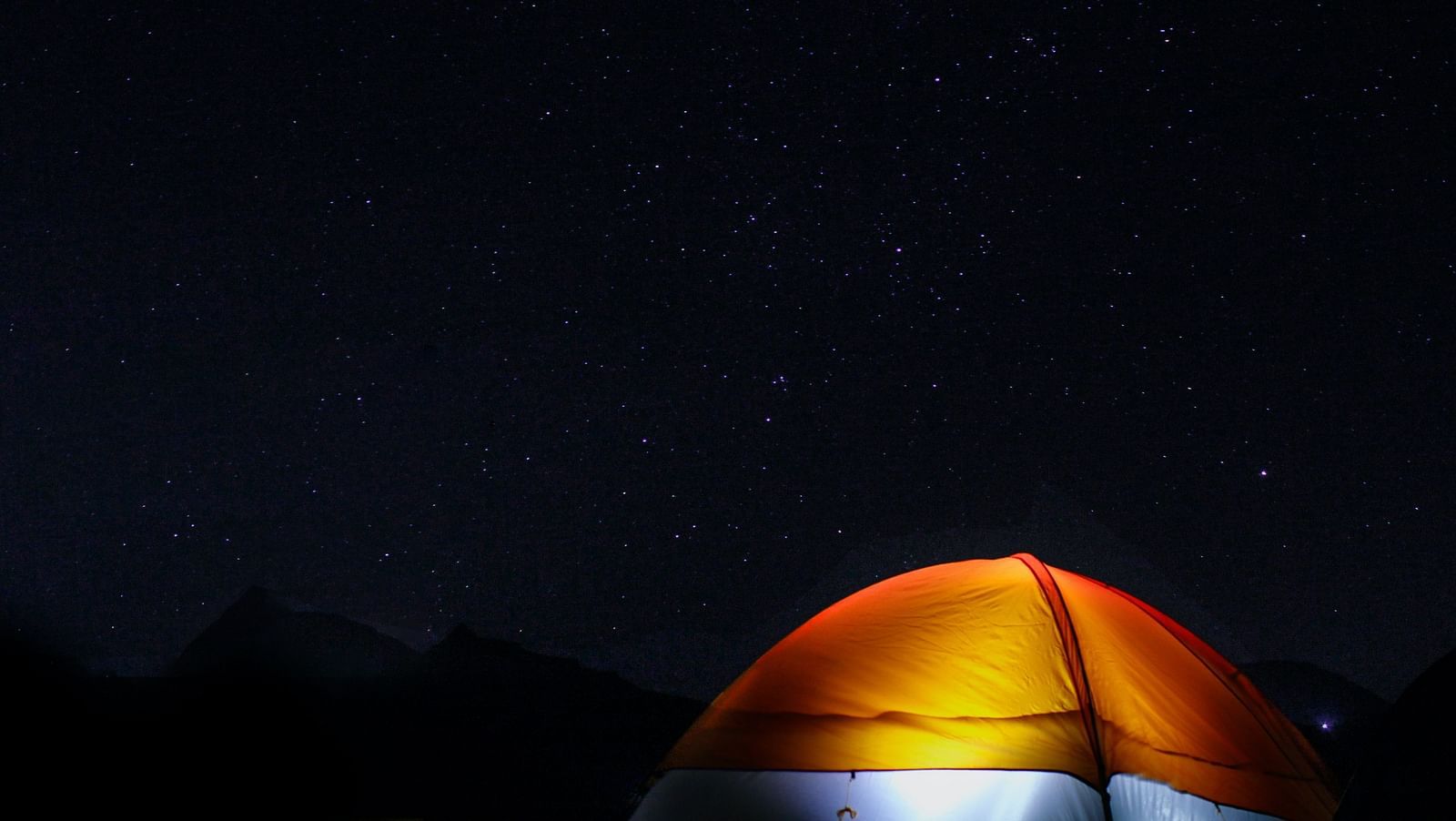 an image of a tent with light on inside Camping near Pawna Lake