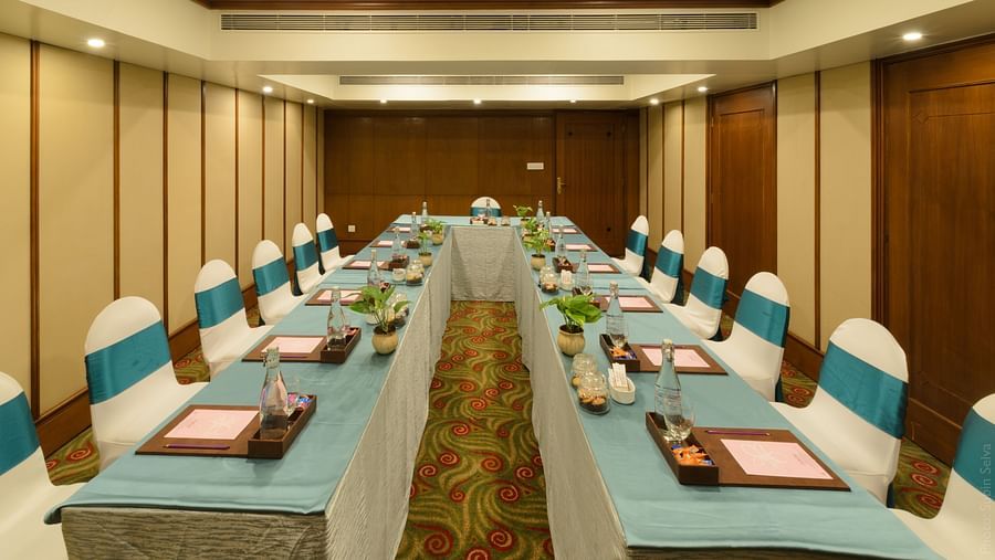 Spacious banquet room with stylish interior designs and seating arrangements at The Orchid Hotel Mumbai Vile Parle