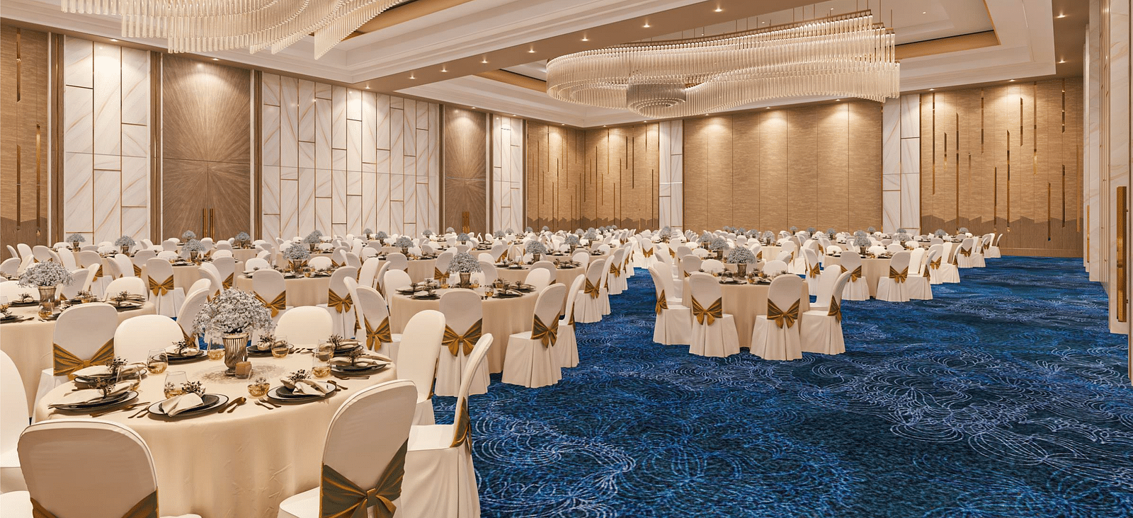 A banquet seating arrangement with chandeliers, blue carpet and modern interior