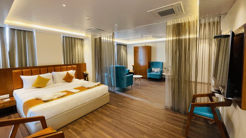 Elegant suite room with cosy bed and modern décor at Quality Inn Rockwell Grand, Bangalore.