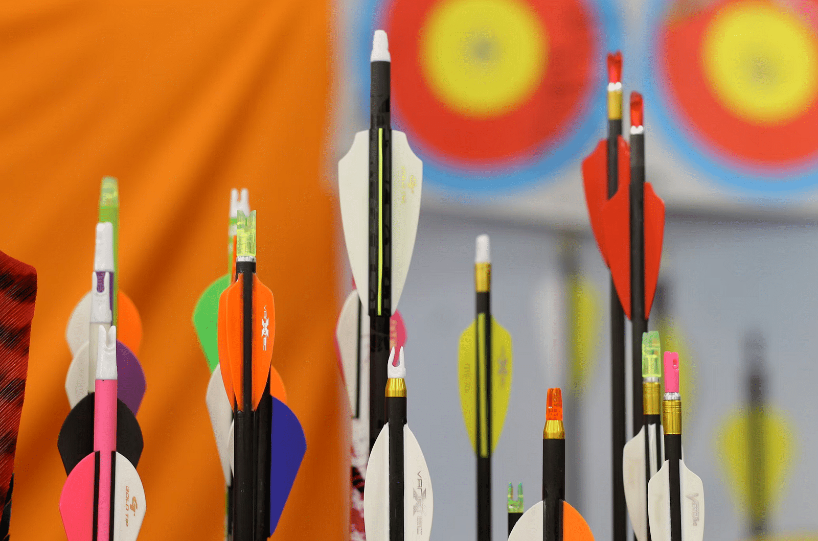 Close-up of colourful arrows in a quiver, ready for archery at Nirantara Resort & Spa.