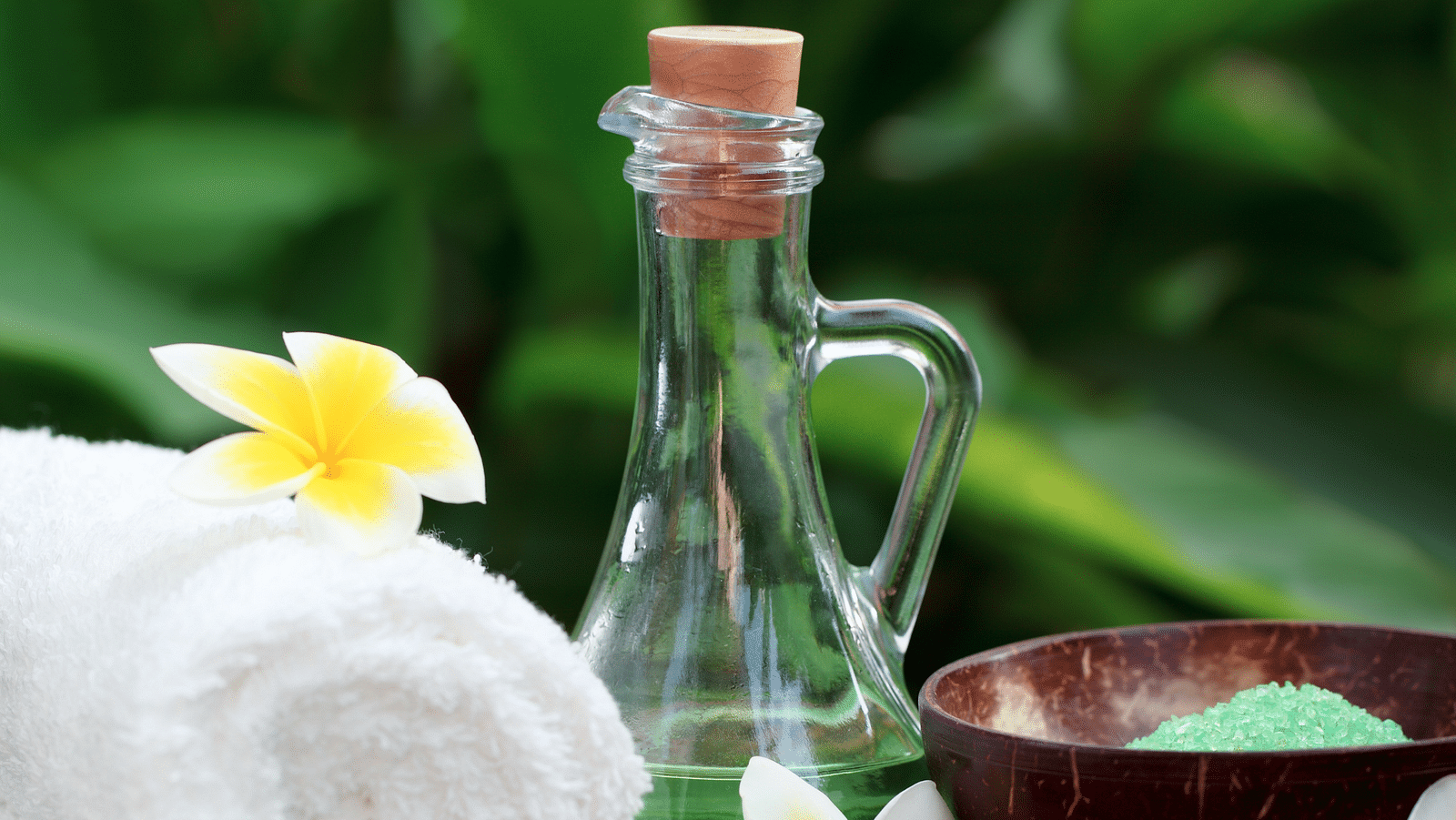 an image of  rolled up towel and a glass jar symbolises wellness - Rhythm Lonavala