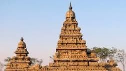 The exterior view of the Shore Temple, showing detailed stone carvings and towers.
