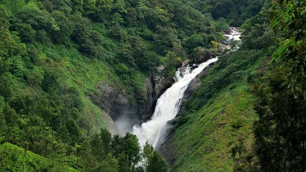 Aerial view of the waterfalls with mountains flanking the sides