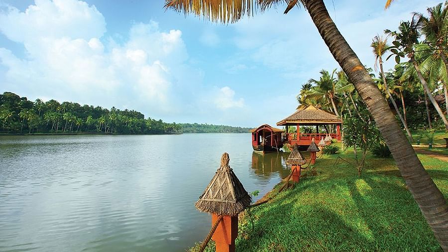  A balcony setup overlooking the lake with a scenic natural view, accessible via a pathway leading to the area