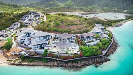 Ariel view of Tamarind Hills Resorts and Villas featuring the exterior of the resort surrounded by the sea.