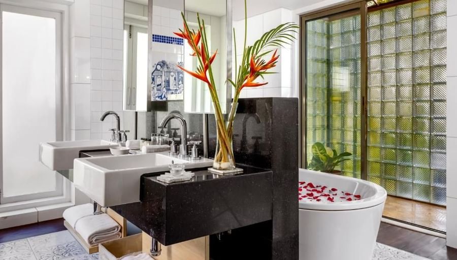 overview of the bathroom with the bathtub and sink area in view - Caravela Beach Resort Goa