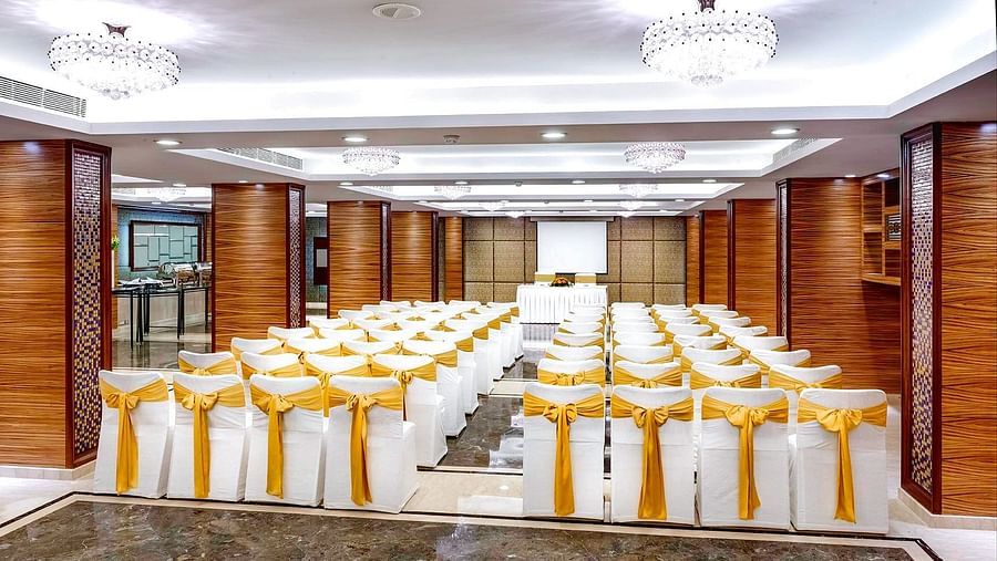 A banquet hall with beautifully decorated chairs at Kenilworth Hotel, Kolkata.