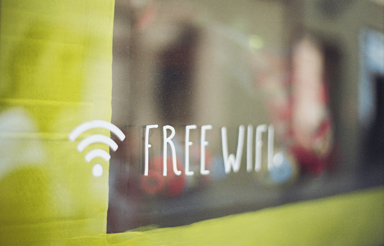 a glass window with free Wi-Fi written on it 