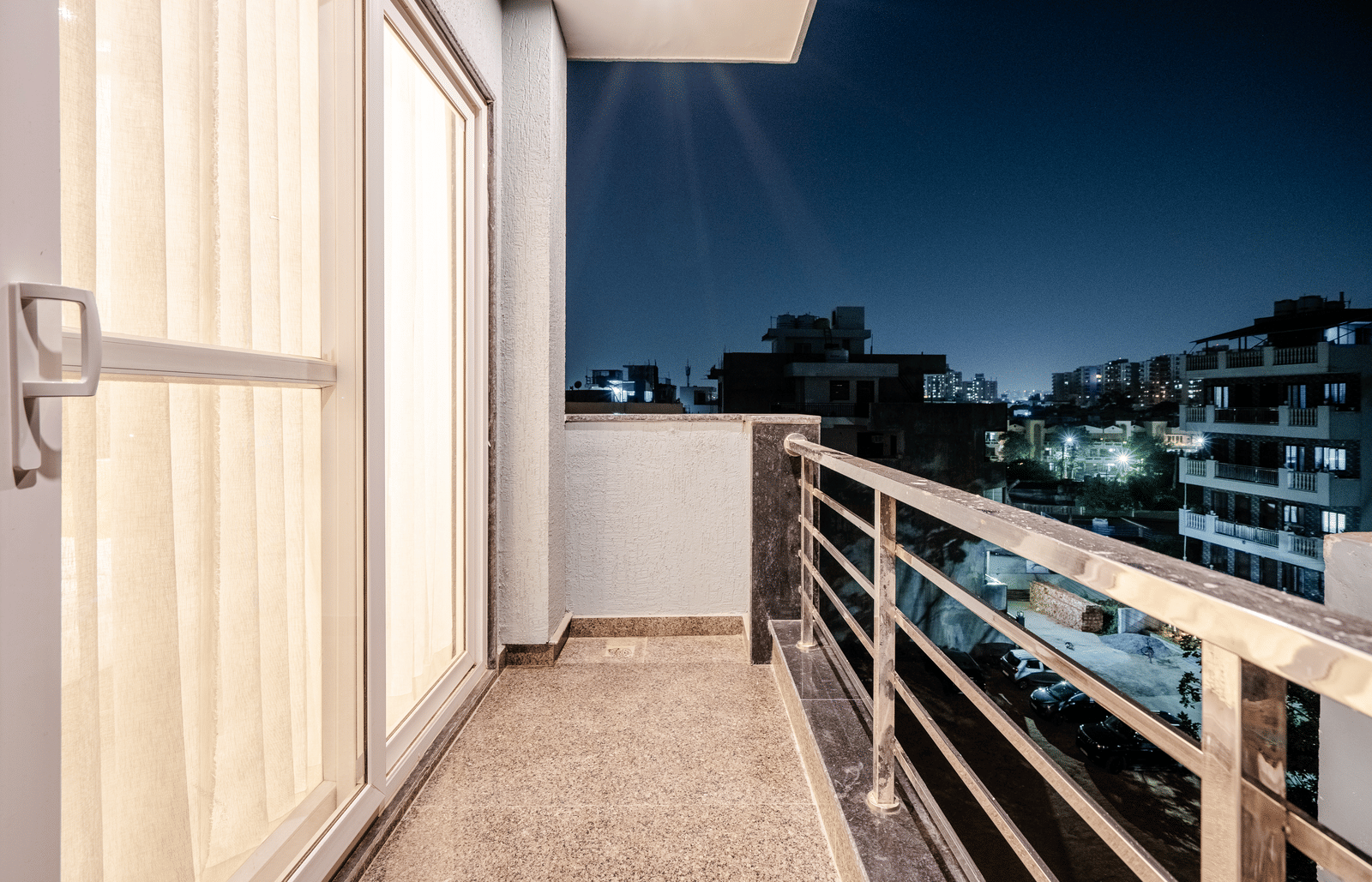 Private balcony offering city views from the apartment at Lime Tree 1BHK Service Apartment Near Artemis Hospital Gurgaon.
