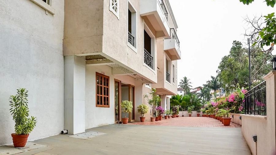 Exterior view of a La Vida Studio Inn Goa and pathway.