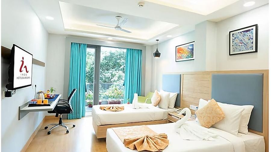 This twin room combines comfort and style with two cozy beds, modern décor, and a balcony view. Enjoy amenities like a flat-screen TV, work desk, and coffee maker for a pleasant stay.