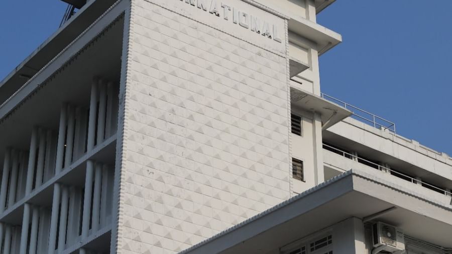 A hotel building at Shilton International, Kochi, under a clear sky, showcasing its modern architecture.