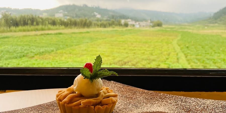 A cupcake placed on a surface overlooking the window