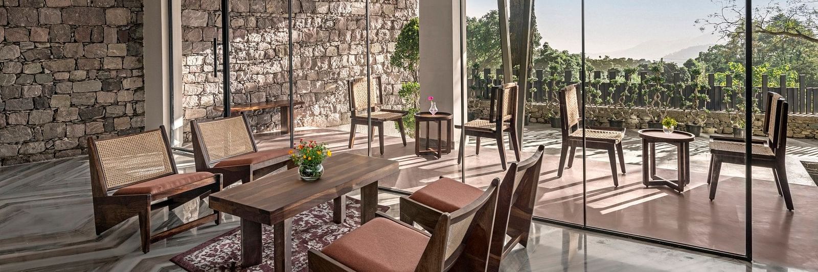 A common area with comfortable chairs - The Samai, Bhimtal