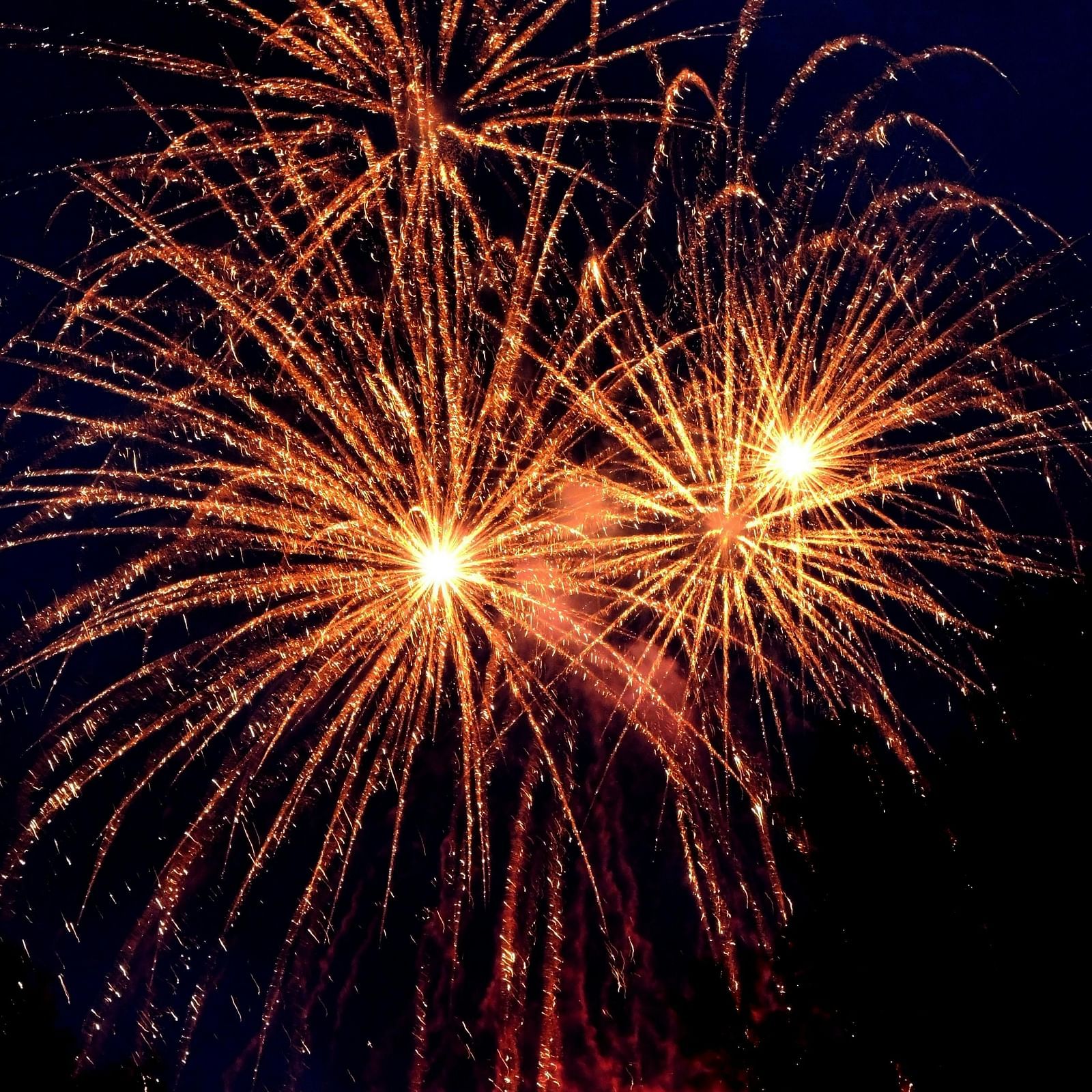 A view of firecrackers being burst at night