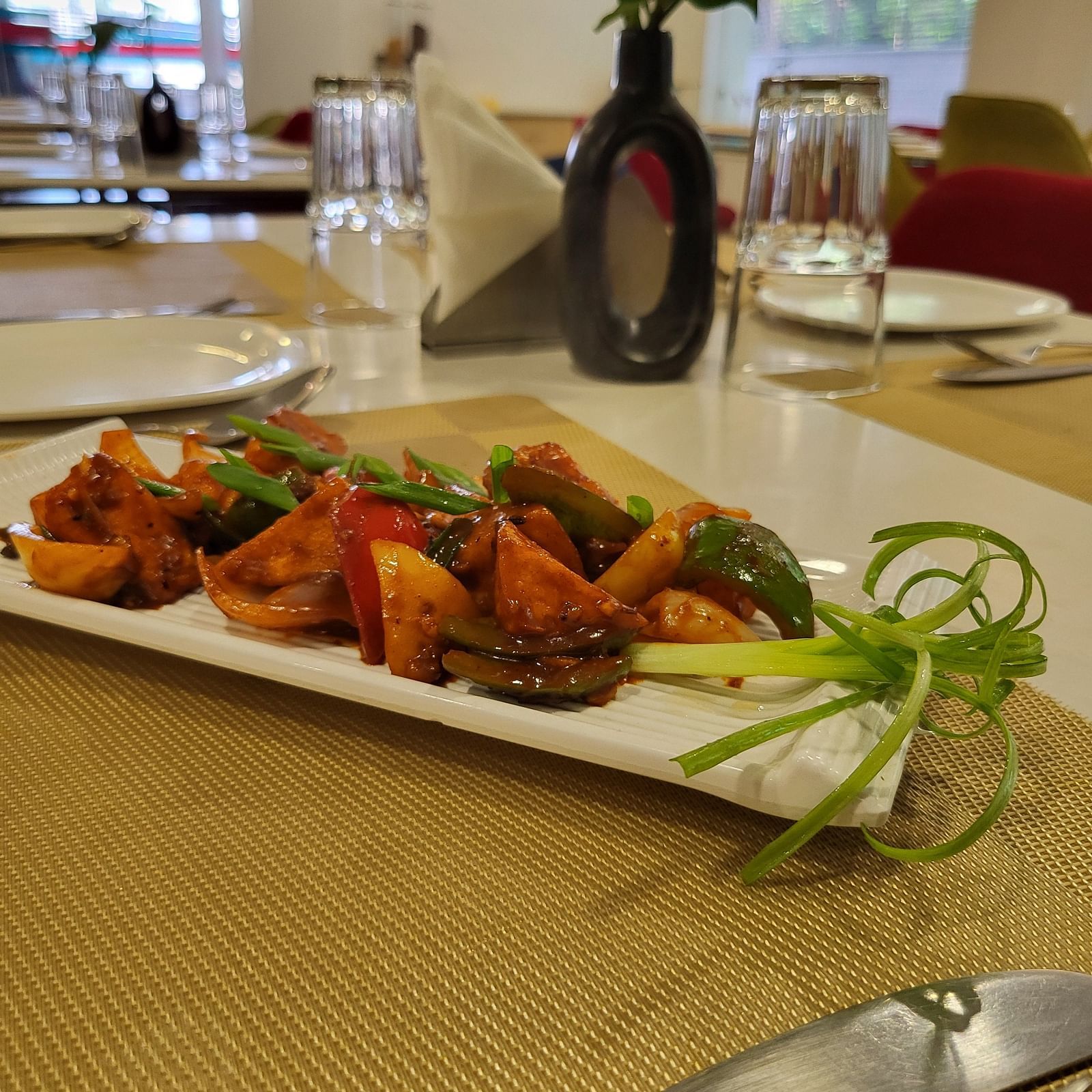 An image of a delicious savoury served in a platter at the restaurant of Inde Hotel Gold Course Extension, Gurgaon