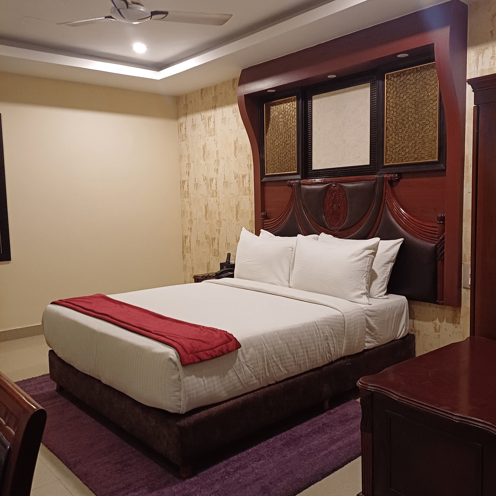 A room with king size bed