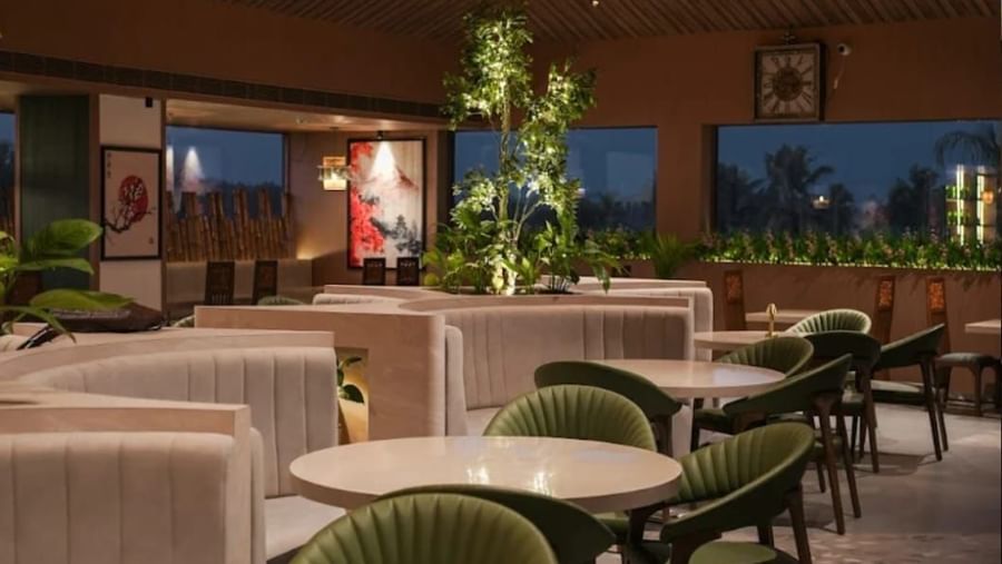 Indoor dining space at Hanami, Uday Suites, featuring elegant decor and spacious seating arrangements.