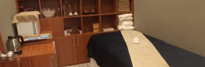 Spa treatment room with single massage bed at Polo Resort Cherrapunjee.