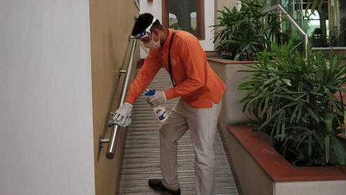 heritage staff santising the resort