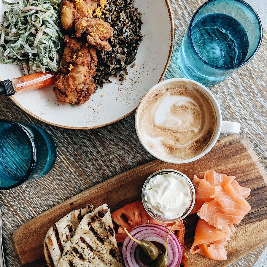 Plate of food and coffee on a table.