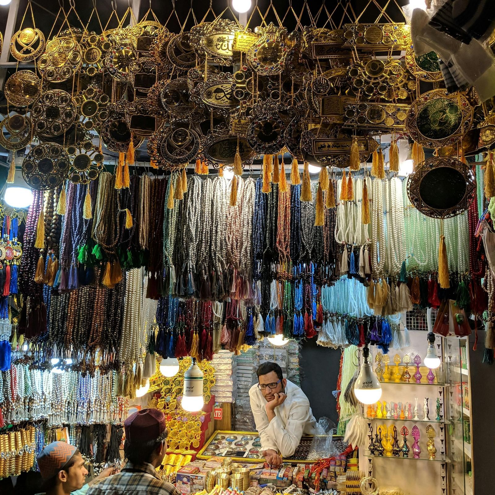 a shop vendor selling jewellery to his customers