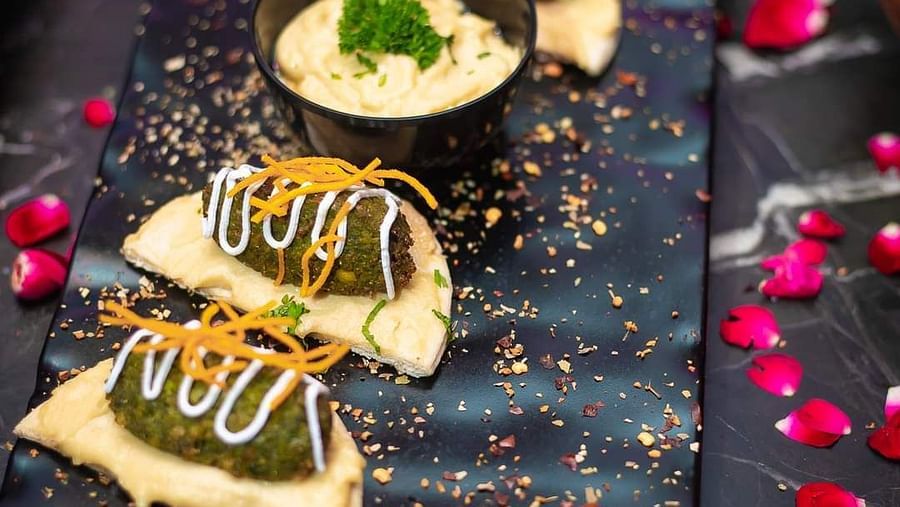 An image of sweet dish served on a platter at Themis Barbecue House, NSP Pitampura