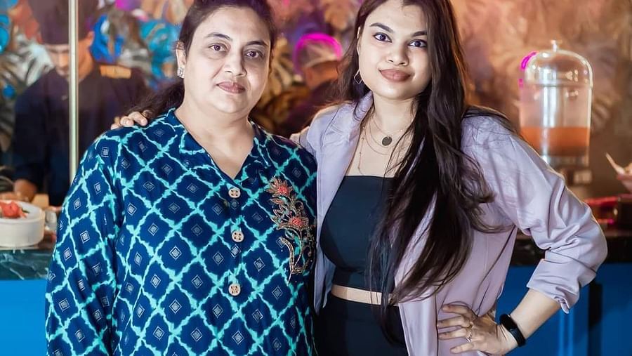 An image of two women posing in Themis Barbecue House, NSP Pitampura