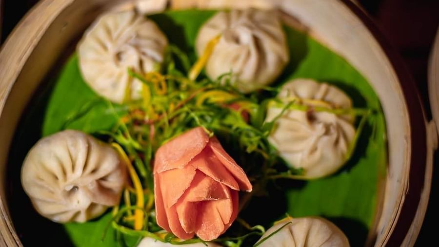 An image of dumplings in a basket at Themis Barbecue House, NSP Pitampura