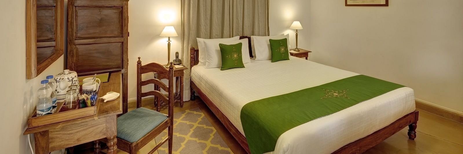 Residency Room with a double bed and work desk and chair at Saraca Hotel, Lucknow