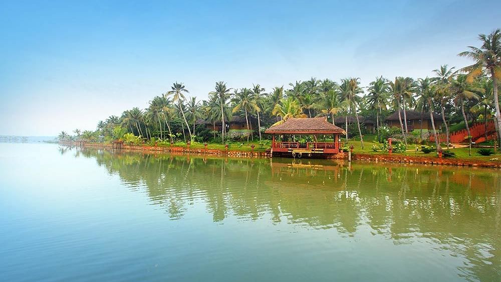  A balcony setup overlooking the lake with a scenic natural view, accessible via a pathway leading to the area