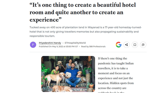 An Economic Times feature about sustainable hospitality featuring the owners posing with their dogs at Tranquil Resort, Wayanad.