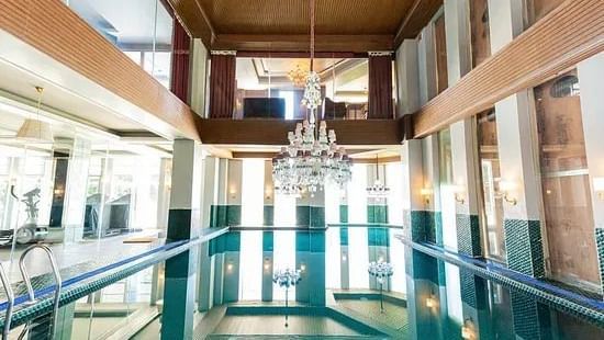 This is the indoor swimming pool at The Manor Luxury Apartments, Shimla, offering a tranquil space for guests to relax and unwind.