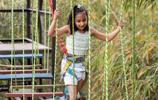 A small girl walking through a bridge.- Bamboo Saa Resort & Spa, Udaipur