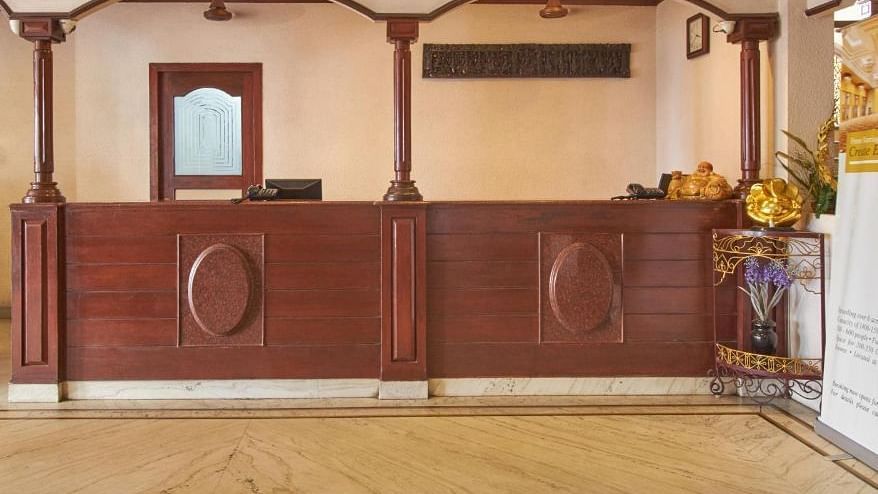 Image of Reception of the hotel with a wooden exterior - Jayaram Hotel, Pondicherry