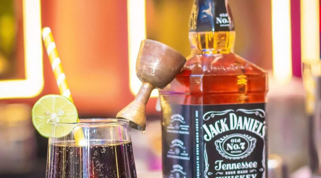 An image of a bottle of jack danials and a glass next to it at Themis Barbecue House, NSP Pitampura