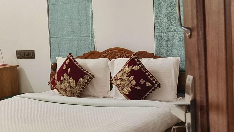 View of a double bed from the door of 104 room at Ananda Holiday Home, Wayanad 1